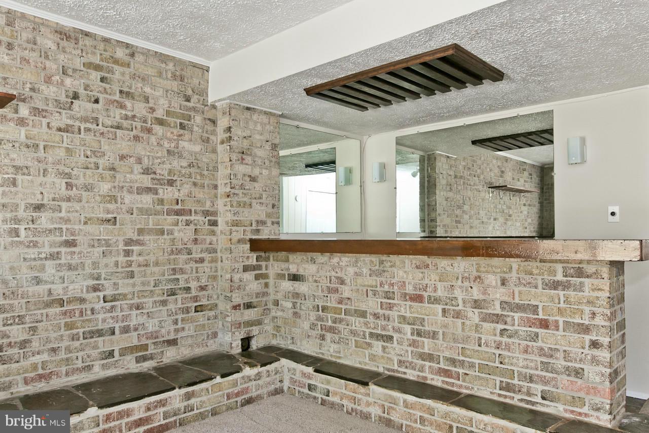1668 Colonial Way Frederick, MD 21702 - Photo 18 of 26 Wet bar with brick surround