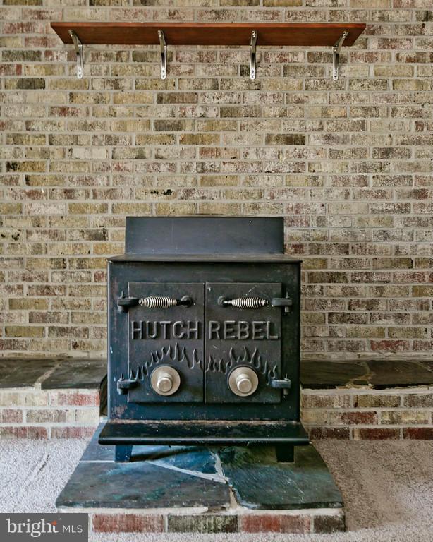 1668 Colonial Way Frederick, MD 21702 - Photo 21 of 26 Working wood stove in the basement
