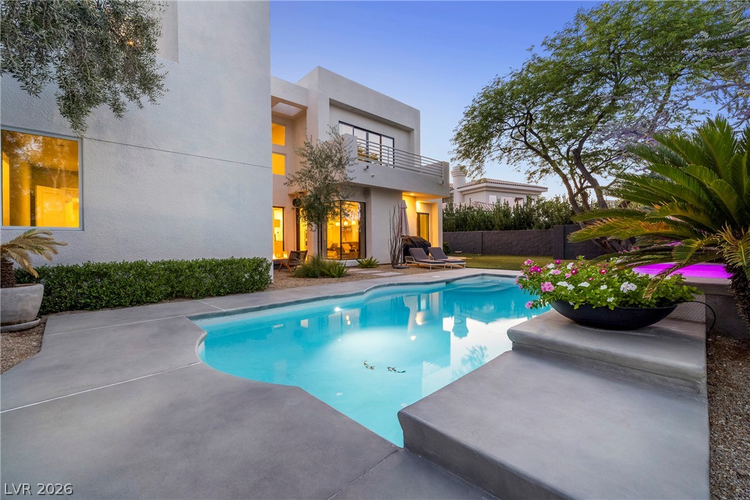 2000 Grouse Street Las Vegas, NV 89134 - Photo 60 of 89 An inviting backyard oasis awaits with a sparkling pool and ample space for relaxation.
