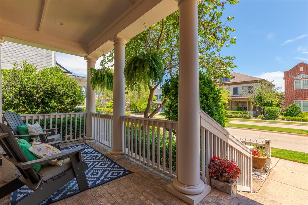 2205 State Boulevard McKinney, TX 75071 - Photo 4 of 40 Covered front porch featuring classic white columns and a brick-patterned floor