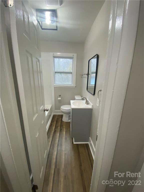 3130 Ridge Avenue Charlotte, NC 28208 - Photo 11 of 12 a bathroom with a sink toilet and shower