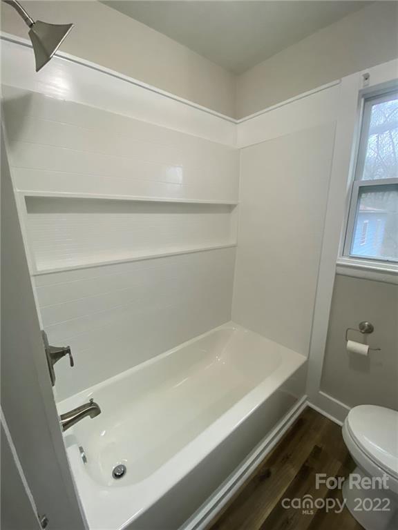 3130 Ridge Avenue Charlotte, NC 28208 - Photo 12 of 12 a bathroom with a bathtub and toilet