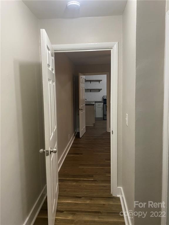 3130 Ridge Avenue Charlotte, NC 28208 - Photo 7 of 12 a view of a hallway with wooden floor and entryway