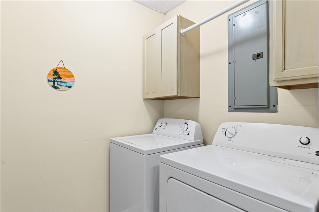 322 Tribble Street Honea Path, SC 29654 - Photo 16 of 35 Functional cabinetry provides convenient storage space directly above the laundry appliances.