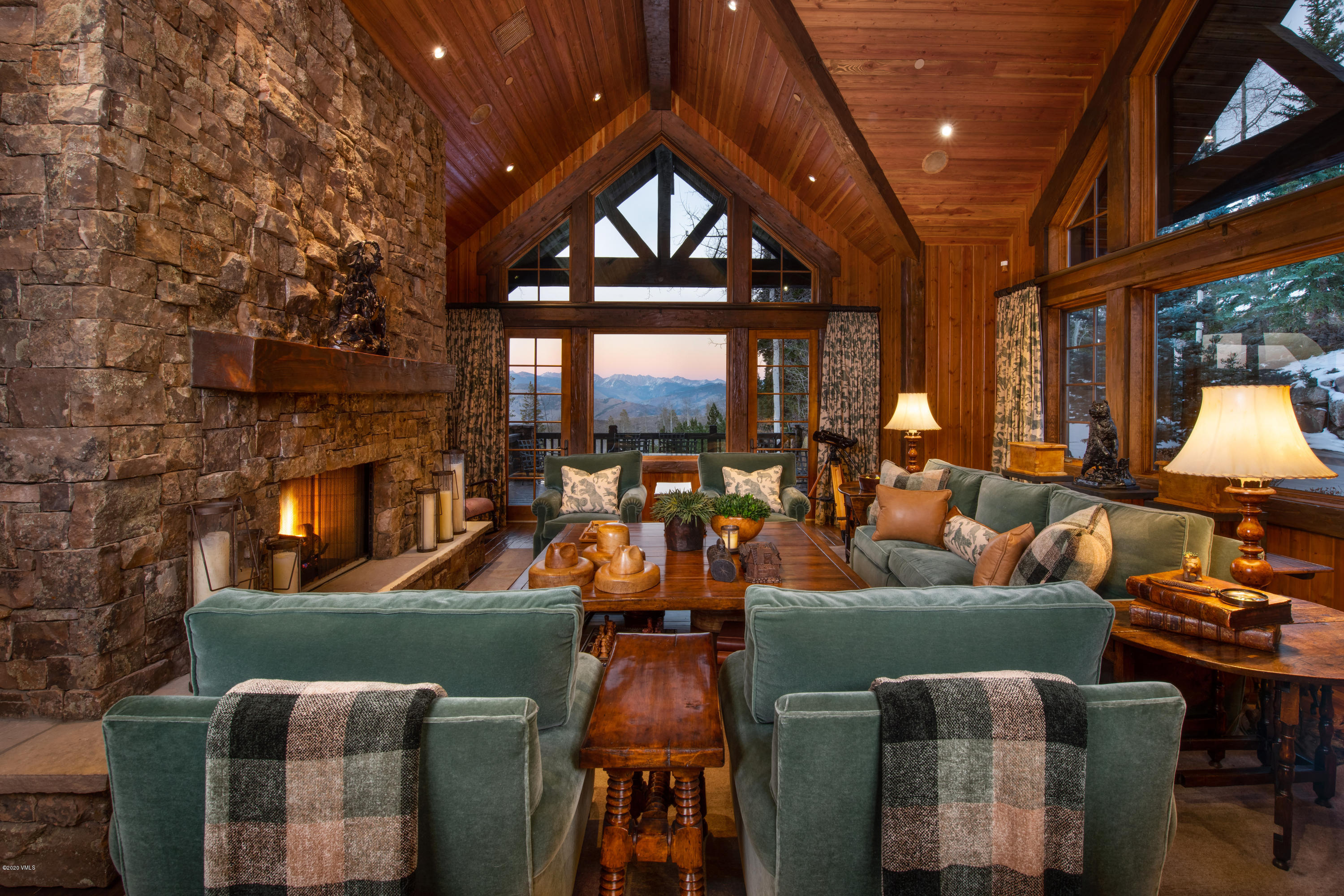 2916 Daybreak Ridge Road Avon, CO 81620 - Photo 1 of 15 a living room with furniture a fireplace and a flat screen tv