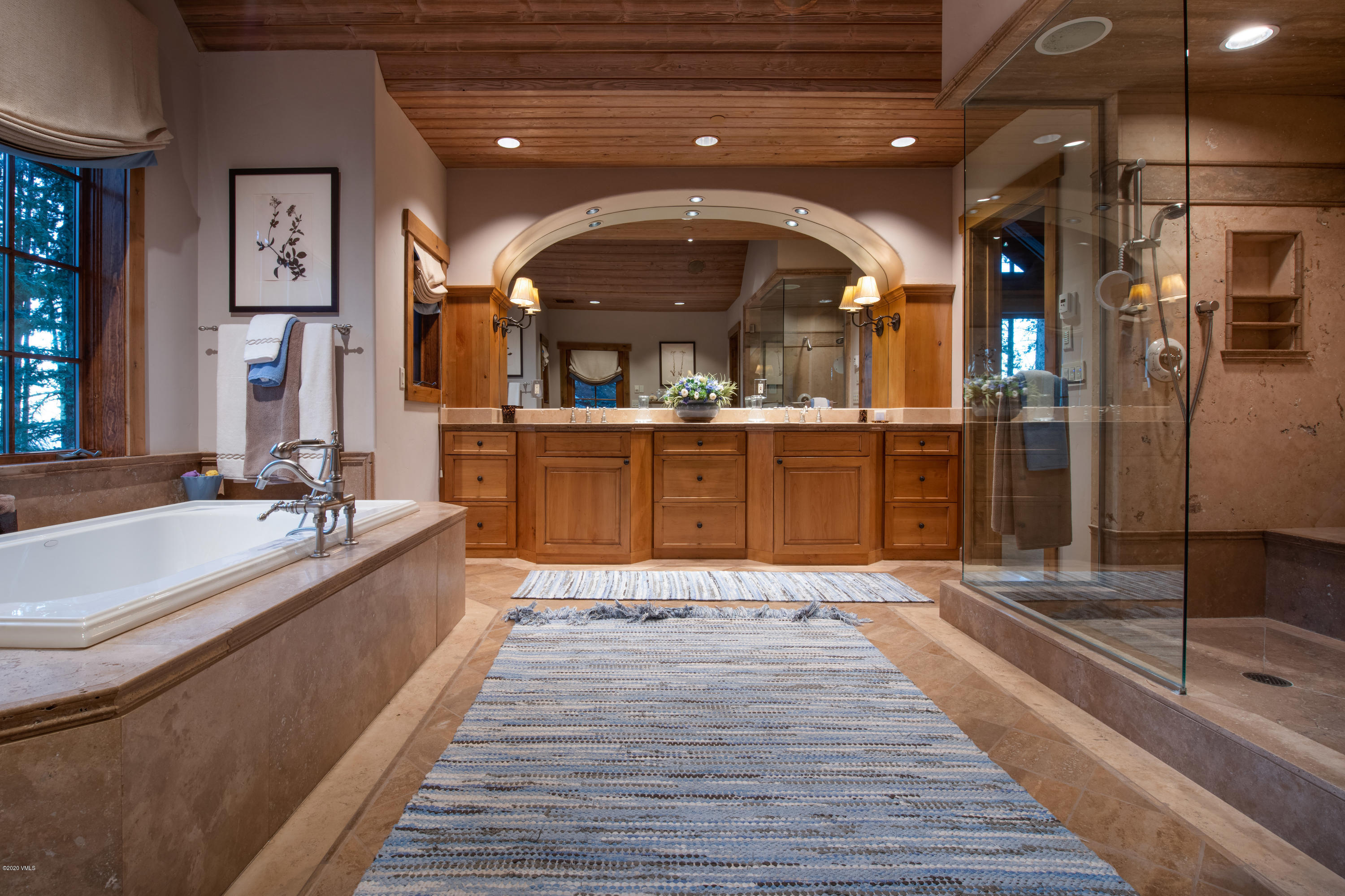 2916 Daybreak Ridge Road Avon, CO 81620 - Photo 11 of 15 a large kitchen with stainless steel appliances granite countertop a large kitchen island a stove and a sink