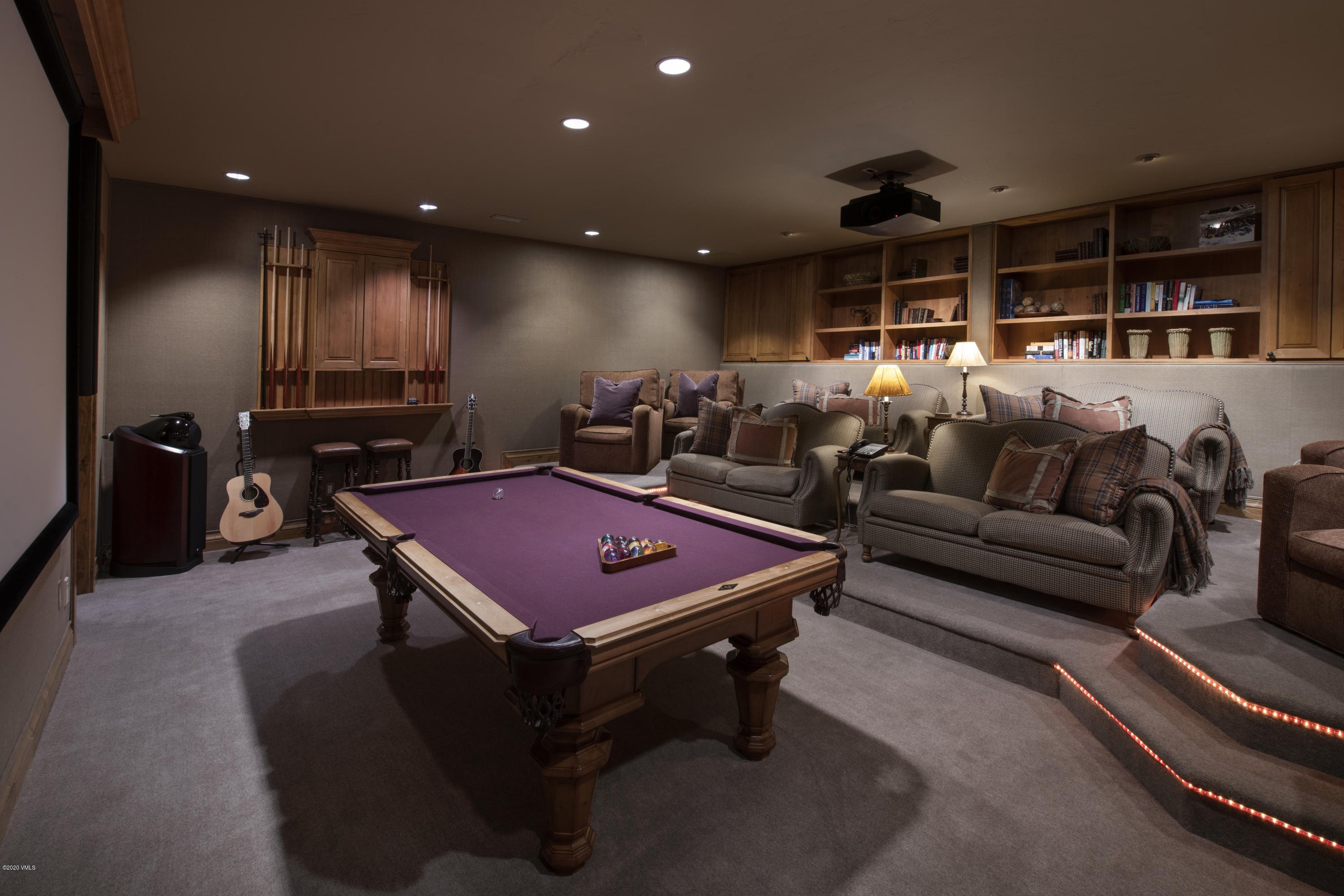 2916 Daybreak Ridge Road Avon, CO 81620 - Photo 14 of 15 a living room with furniture a flat screen tv and rug