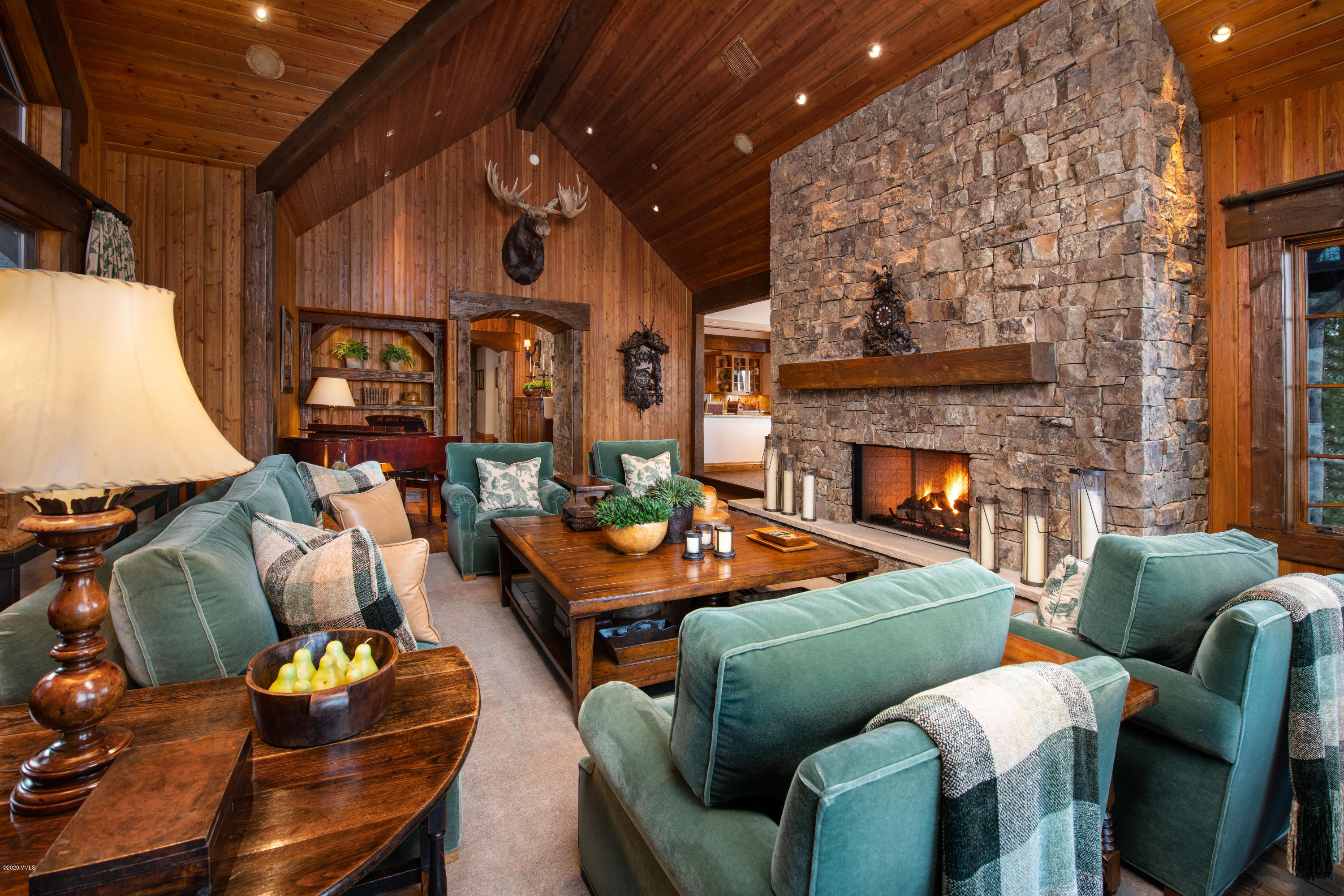 2916 Daybreak Ridge Road Avon, CO 81620 - Photo 3 of 15 a living room with furniture and a fireplace