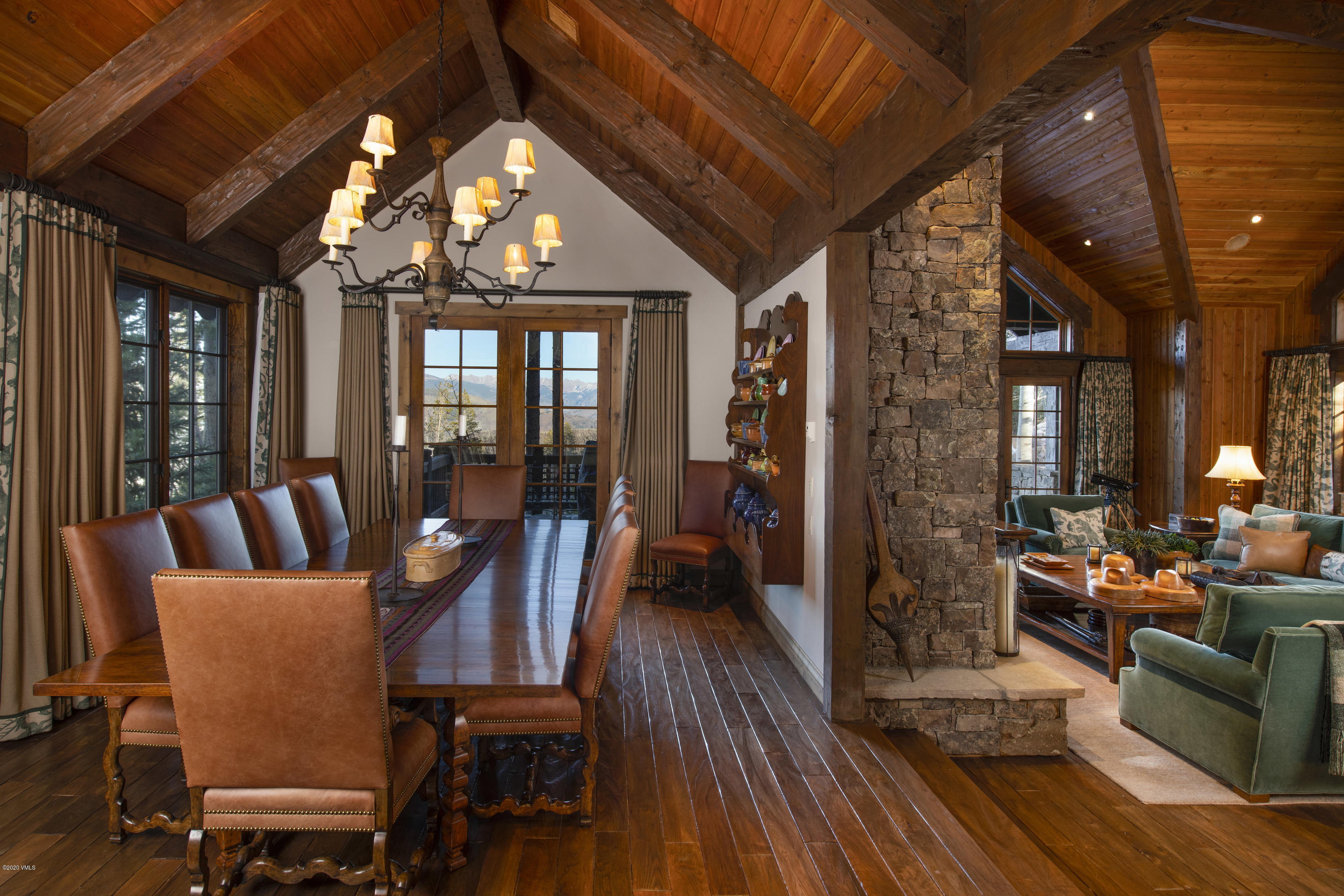 2916 Daybreak Ridge Road Avon, CO 81620 - Photo 5 of 15 a view of a dining room with furniture window and wooden floor
