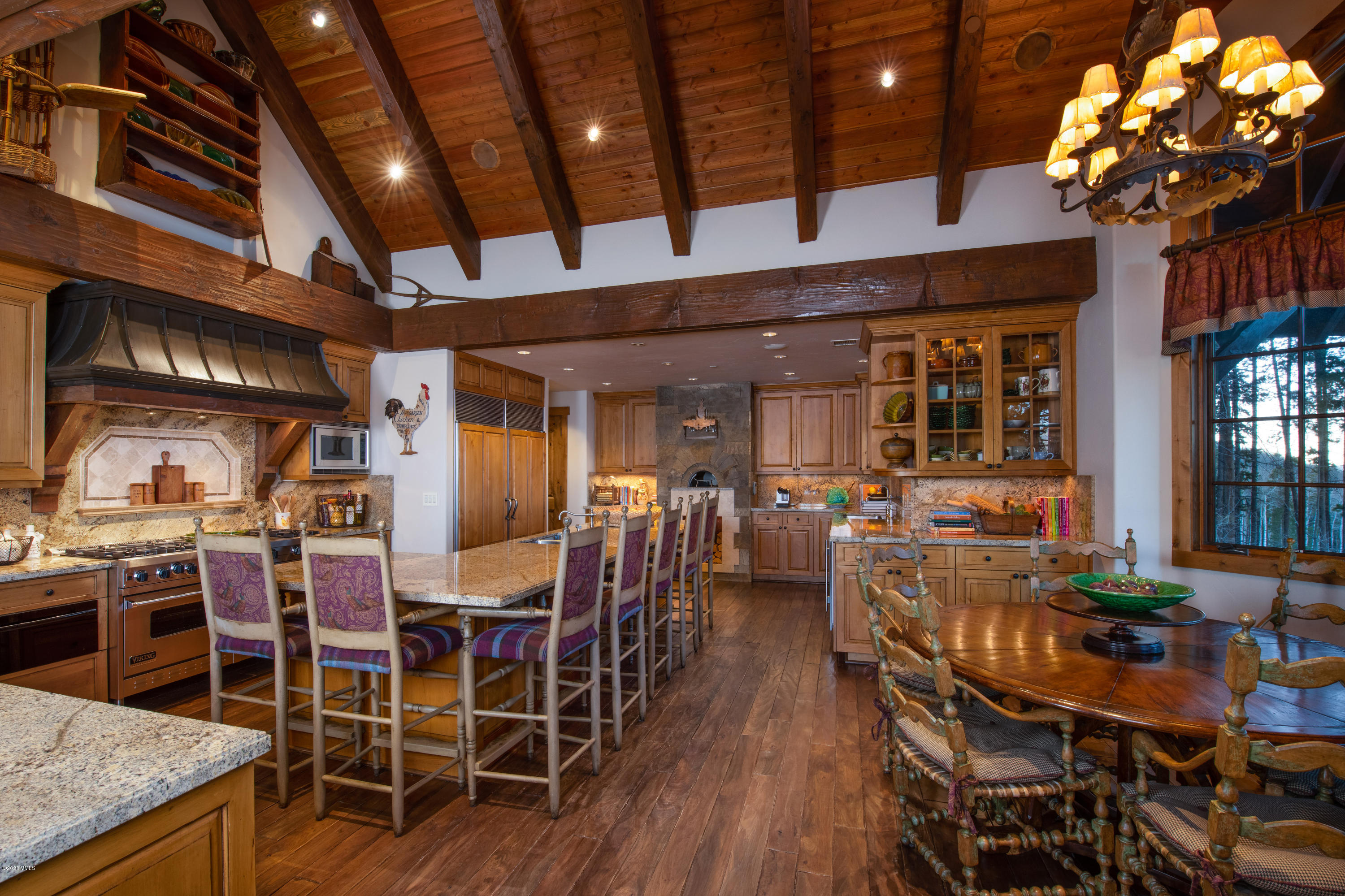 2916 Daybreak Ridge Road Avon, CO 81620 - Photo 8 of 15 a view of a dining room with furniture and chandelier