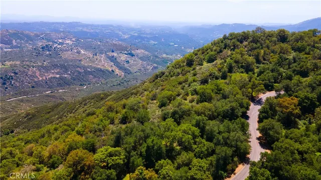 an aerial view of residential house and green space