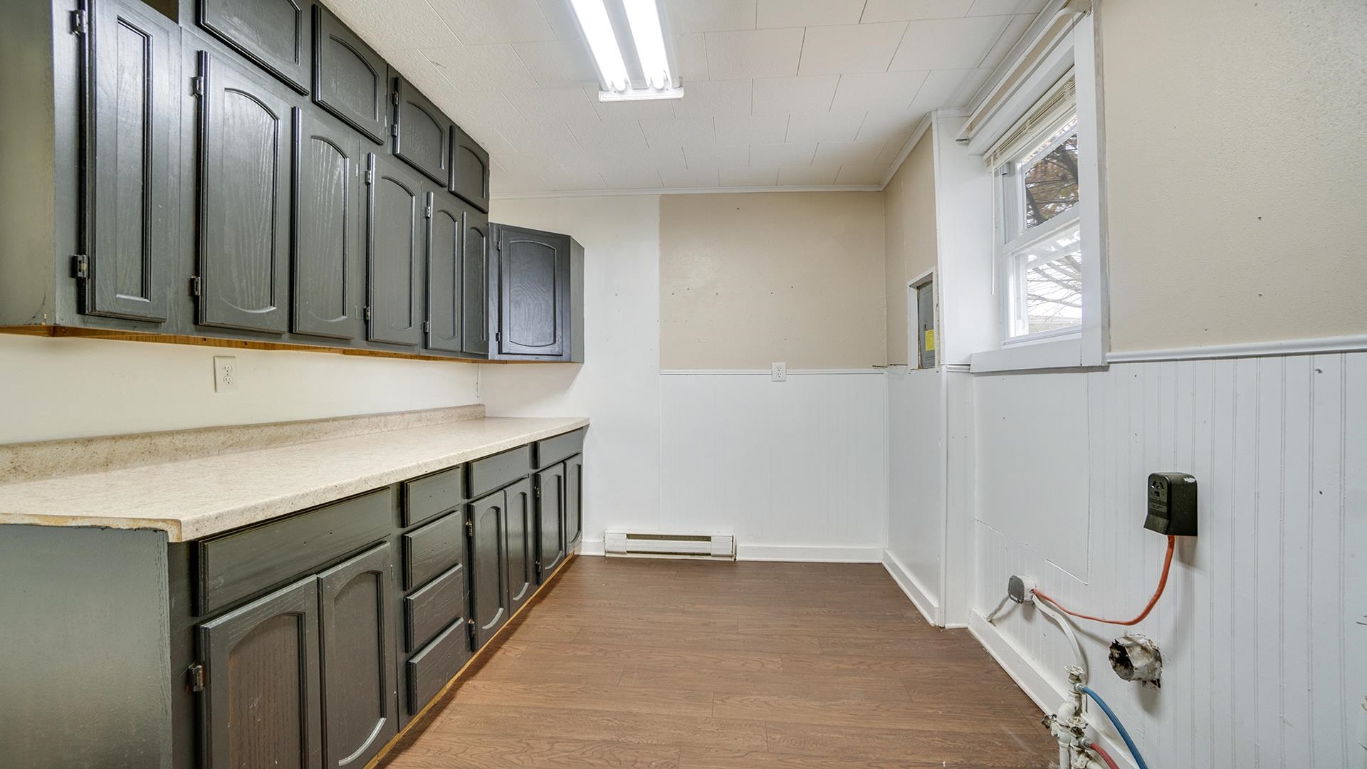 201 West Center Street Mount Morris, IL 61054 - Photo 14 of 33 a kitchen with a sink and cabinets