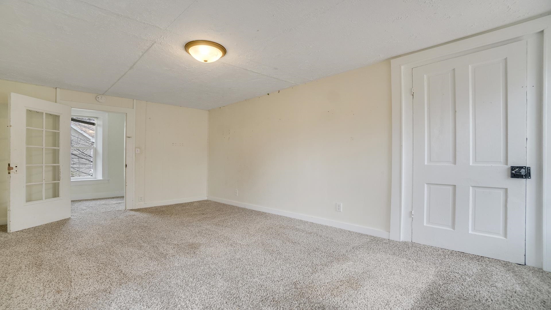 201 West Center Street Mount Morris, IL 61054 - Photo 22 of 33 a view of an empty room with wooden floor and entryway
