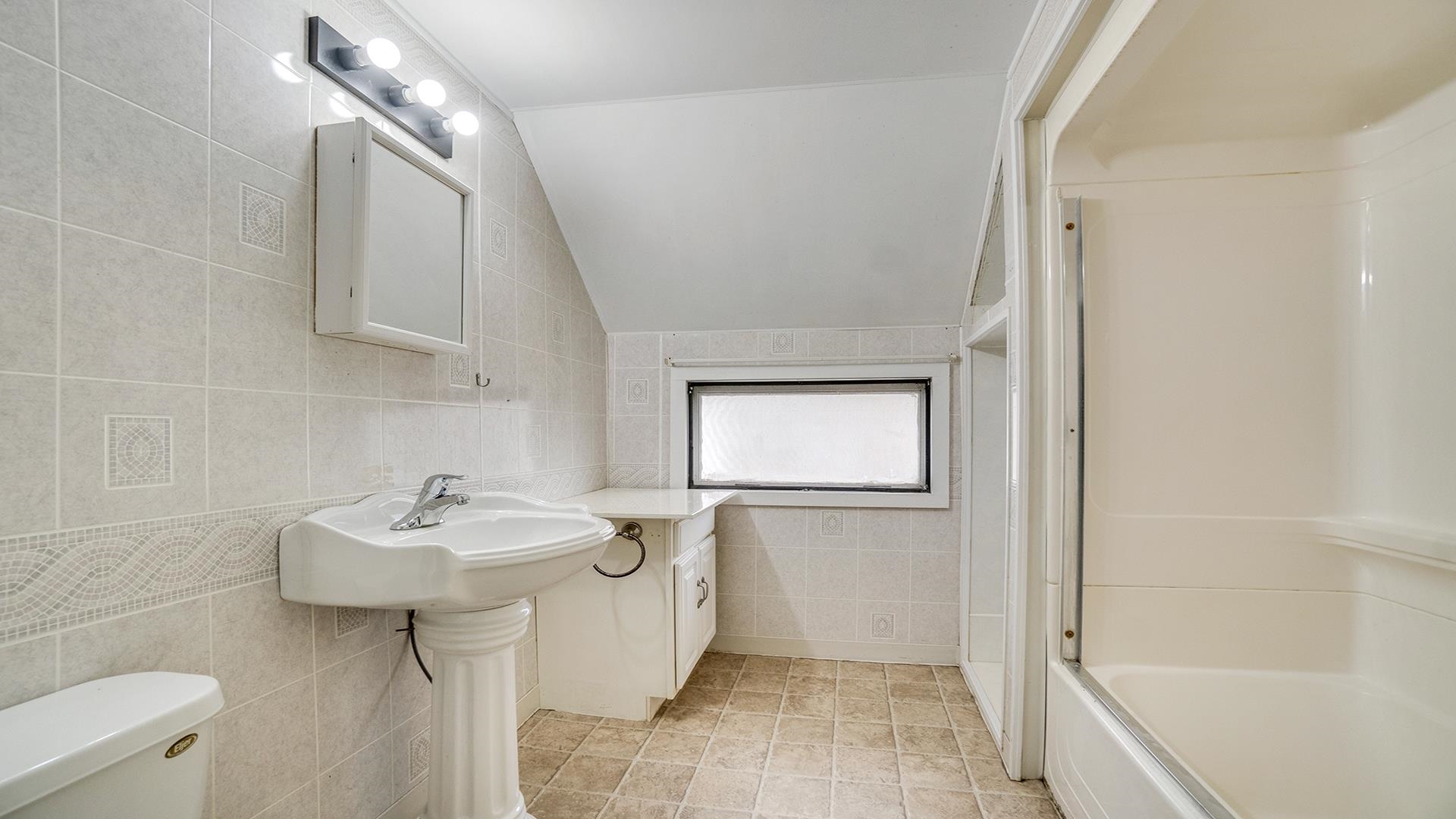 201 West Center Street Mount Morris, IL 61054 - Photo 23 of 33 a bathroom with a sink a toilet and shower