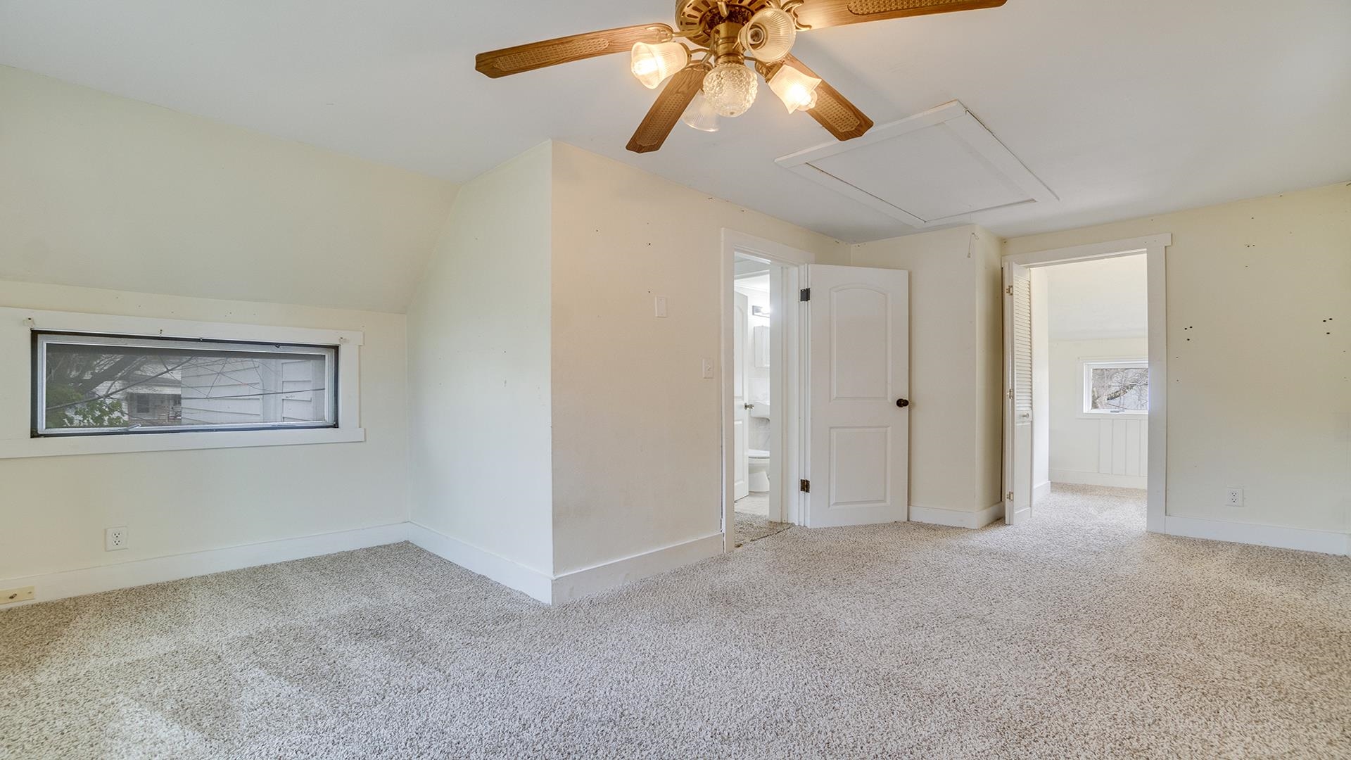 201 West Center Street Mount Morris, IL 61054 - Photo 24 of 33 an empty room with closet and a chandelier fan