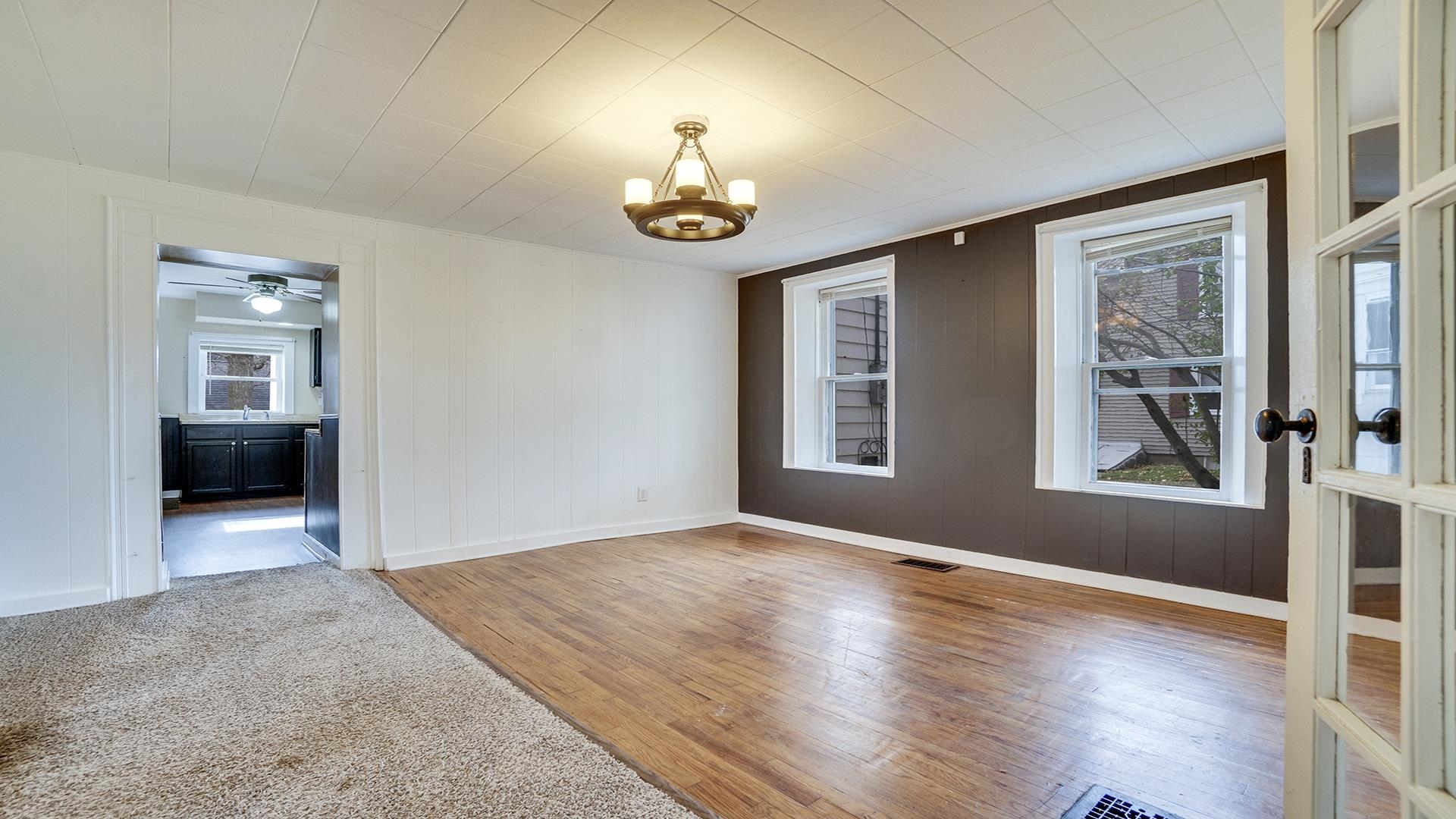 201 West Center Street Mount Morris, IL 61054 - Photo 7 of 33 an empty room with windows and chandelier