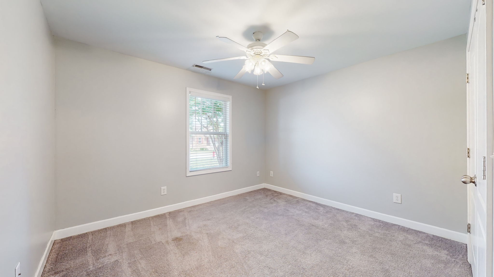 6025 Chickadee Circle Spring Hill, TN 37174 - Photo 21 of 44 an empty room with windows and fan