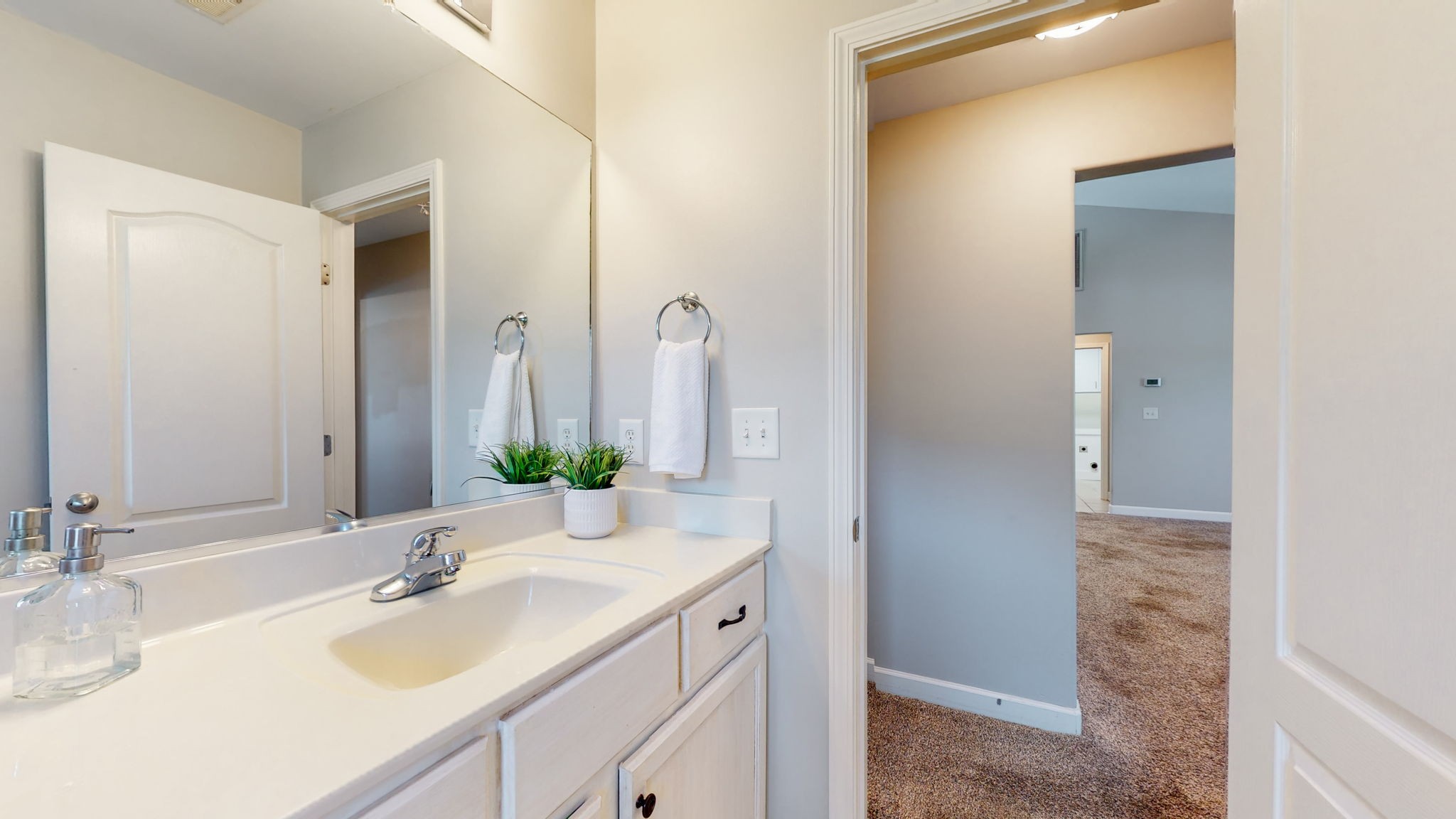 6025 Chickadee Circle Spring Hill, TN 37174 - Photo 24 of 44 a bathroom with a sink and a mirror