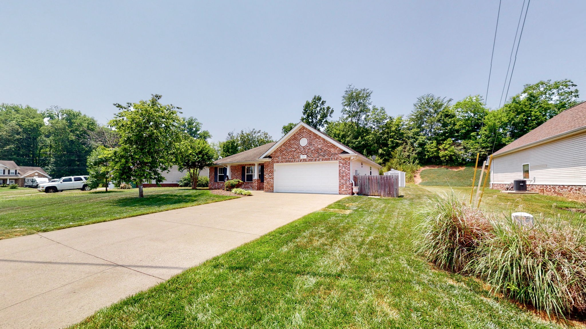 6025 Chickadee Circle Spring Hill, TN 37174 - Photo 30 of 44 a view of a house with a yard and potted plants