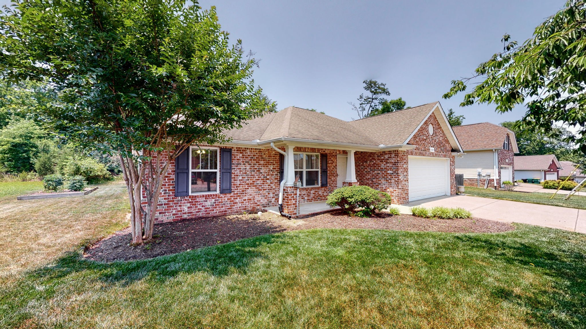 6025 Chickadee Circle Spring Hill, TN 37174 - Photo 31 of 44 a view of a house with a yard and tree s