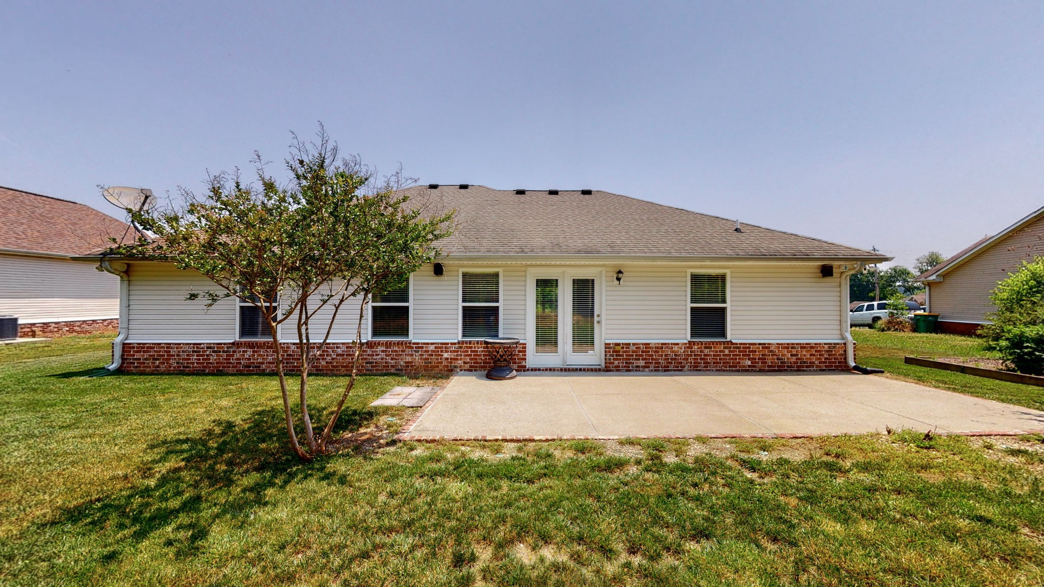 6025 Chickadee Circle Spring Hill, TN 37174 - Photo 34 of 44 a front view of a house with a garden and yard