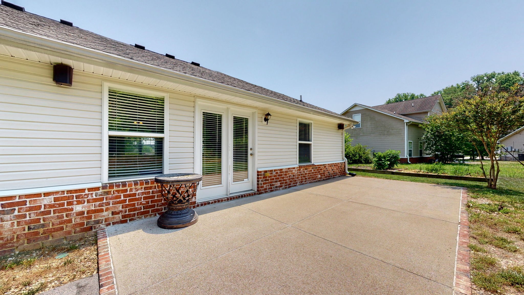 6025 Chickadee Circle Spring Hill, TN 37174 - Photo 35 of 44 a front view of a house with a yard and potted plants
