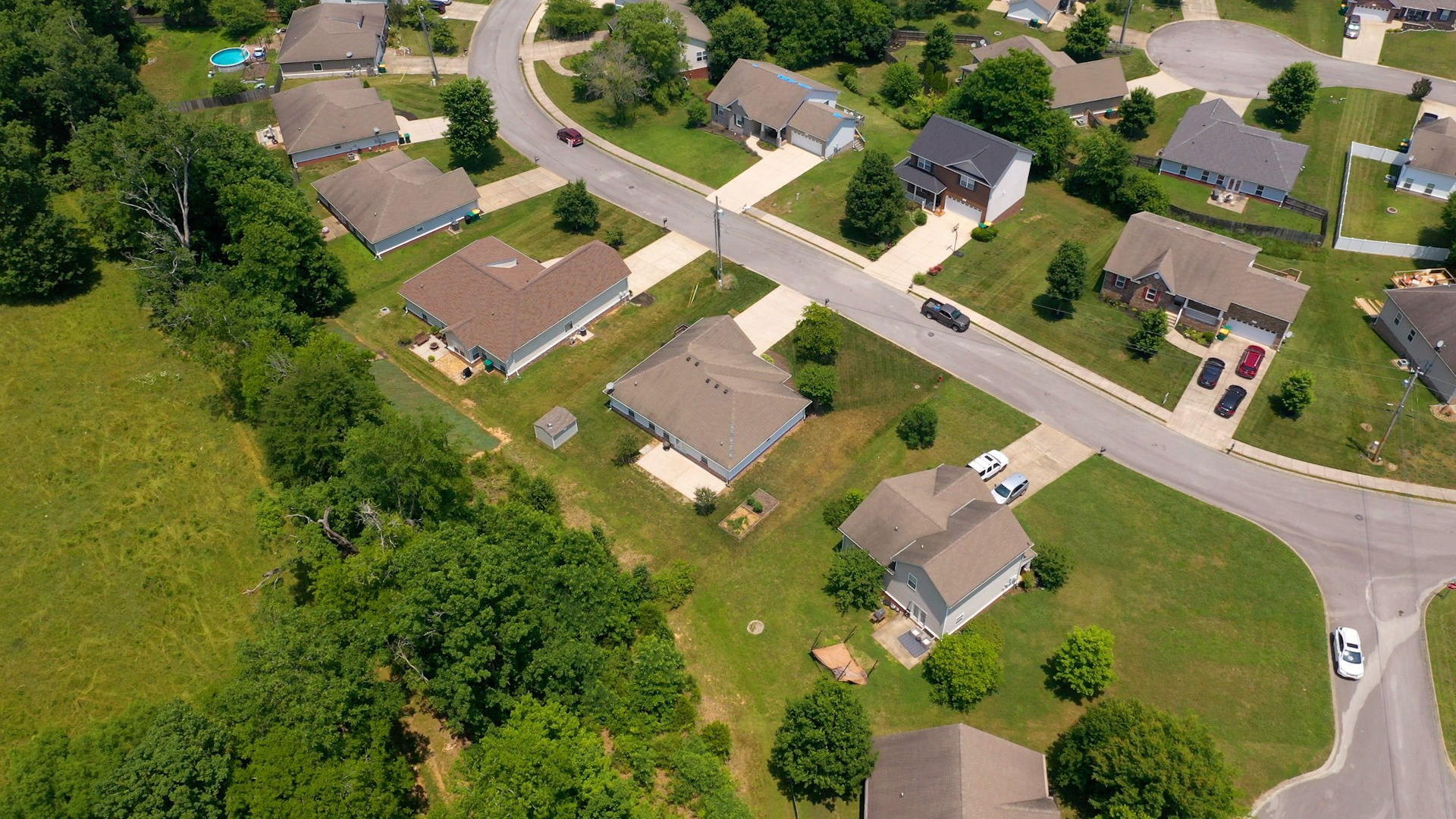 6025 Chickadee Circle Spring Hill, TN 37174 - Photo 41 of 44 an aerial view of residential house with outdoor space and swimming pool