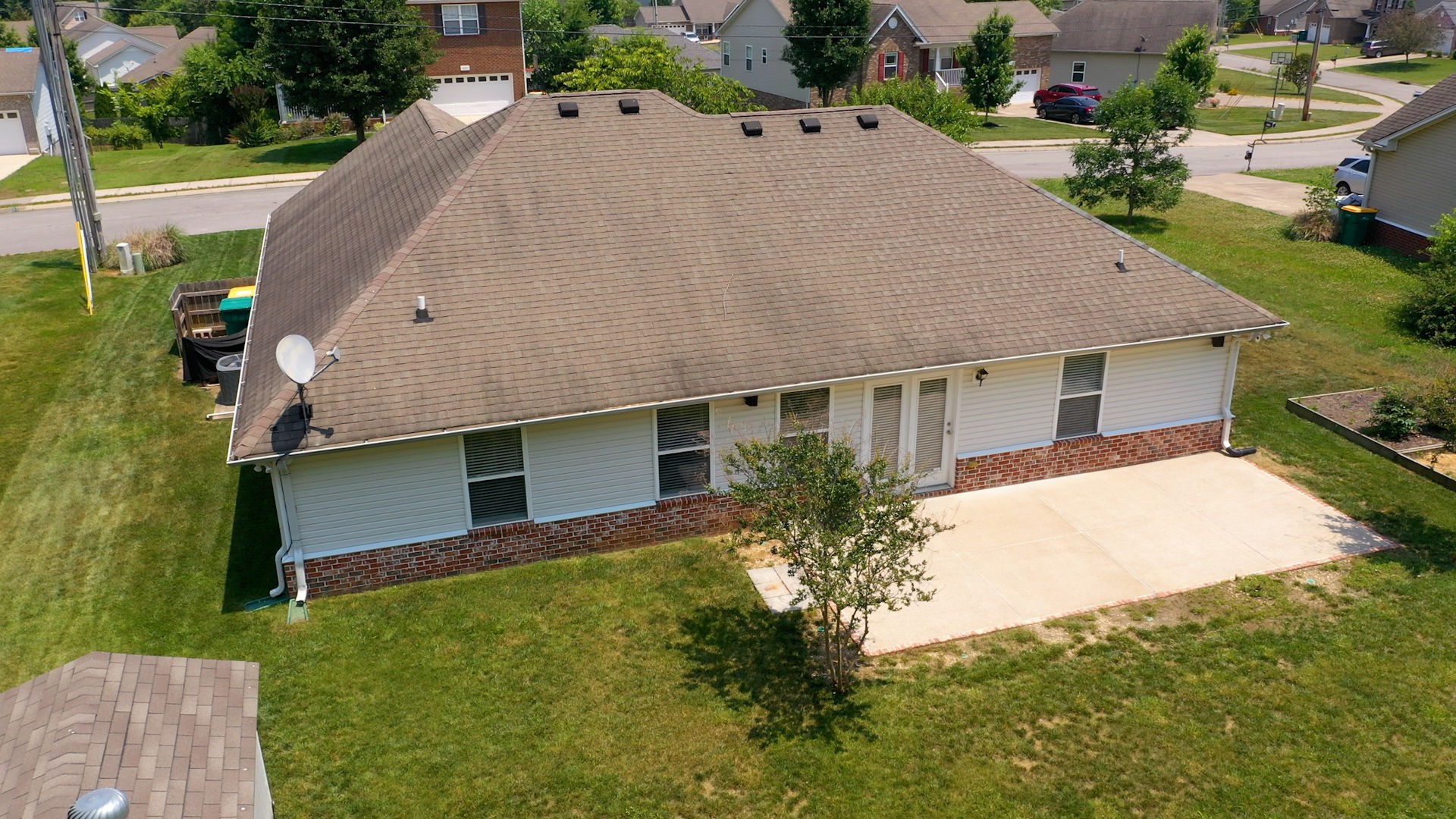6025 Chickadee Circle Spring Hill, TN 37174 - Photo 43 of 44 a aerial view of a house with a yard and garage