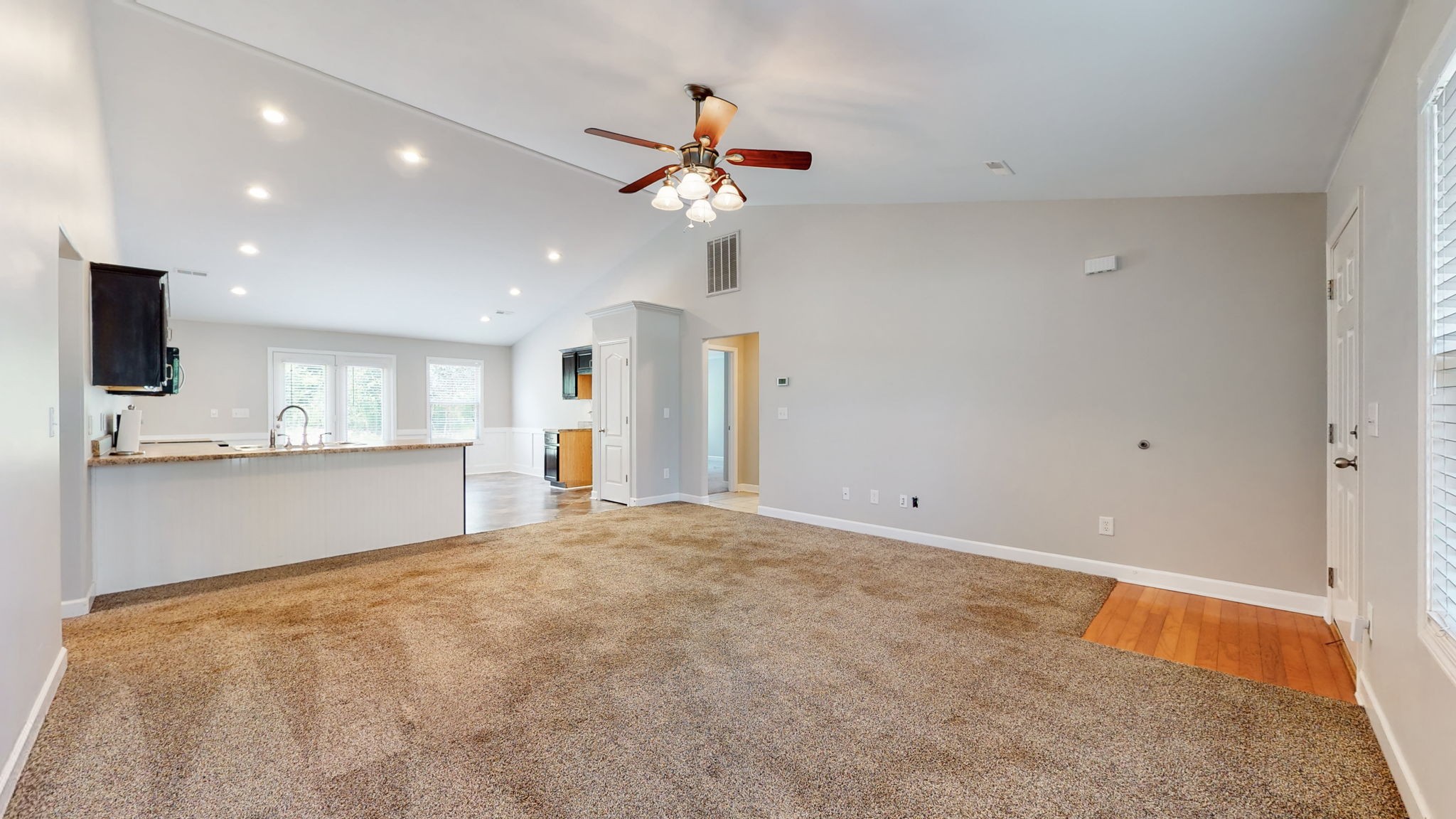 6025 Chickadee Circle Spring Hill, TN 37174 - Photo 6 of 44 a view of an empty room with a kitchen