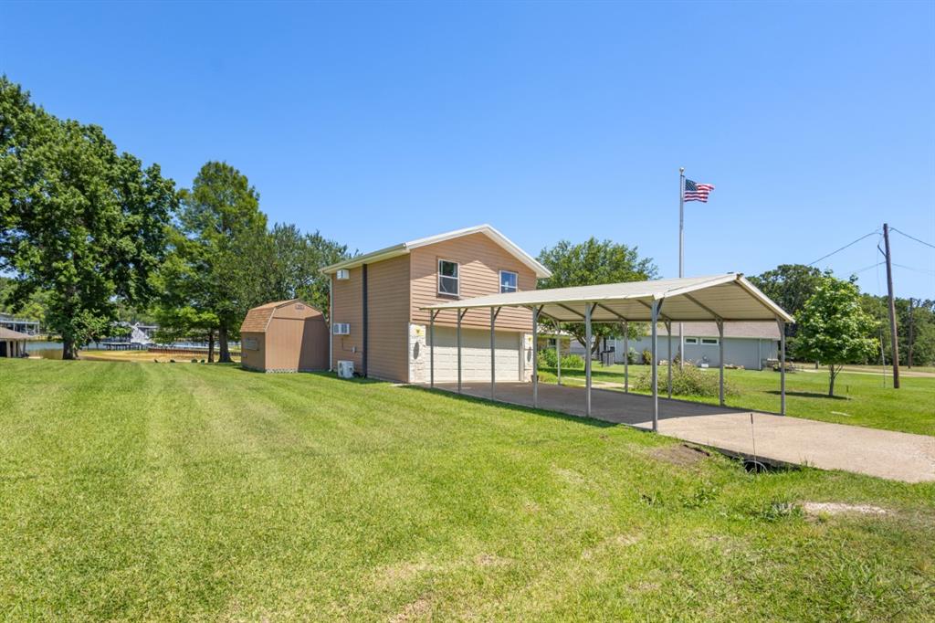 227 Scenic Road Trinidad, TX 75163 - Photo 4 of 40 a view of a big house with a big yard and potted plants
