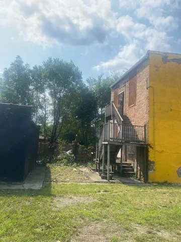 a view of a water fountain and a big yard