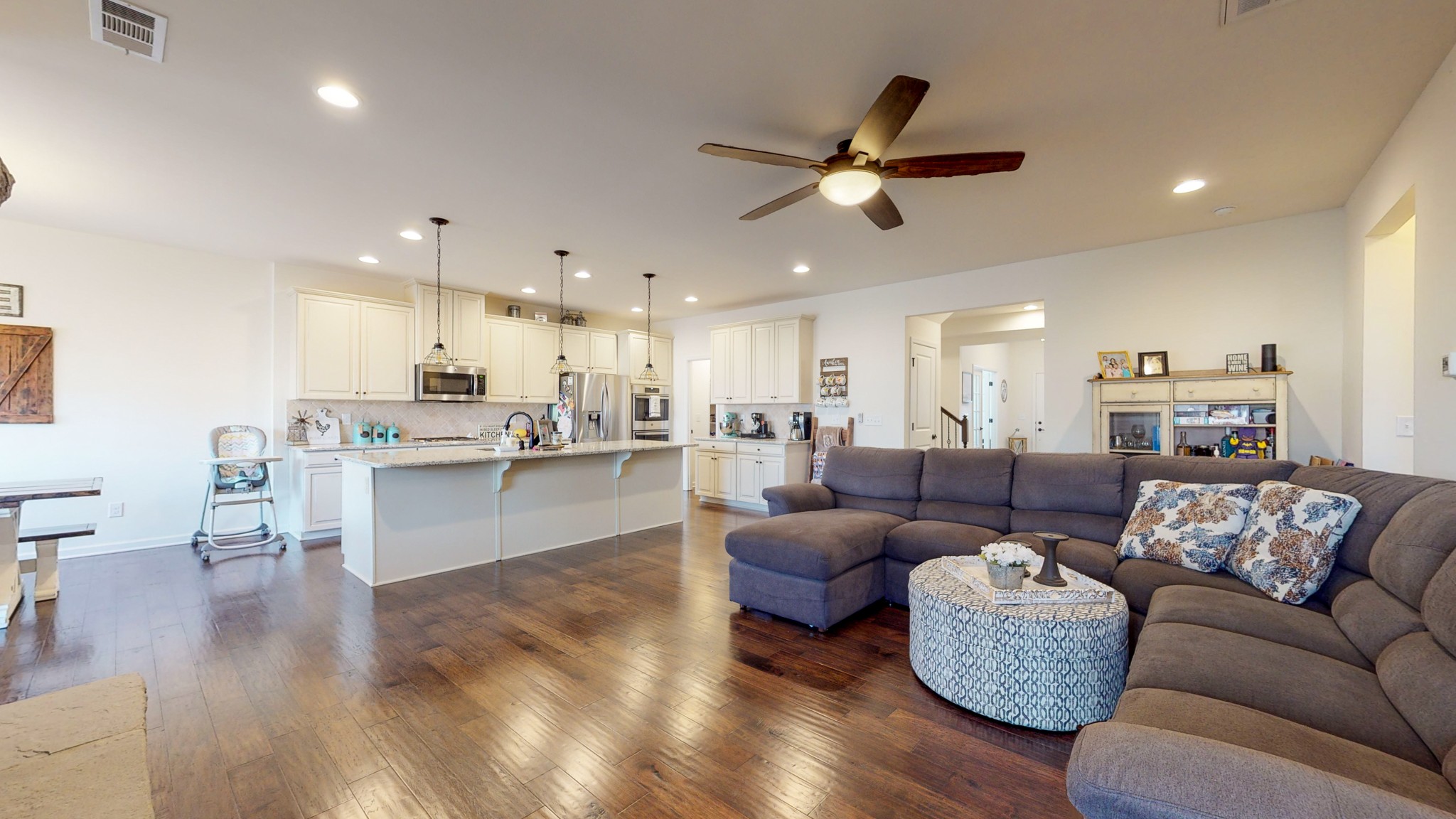132 Hackney Lane Gallatin, TN 37066 - Photo 11 of 40 a living room with kitchen island furniture and a view of kitchen