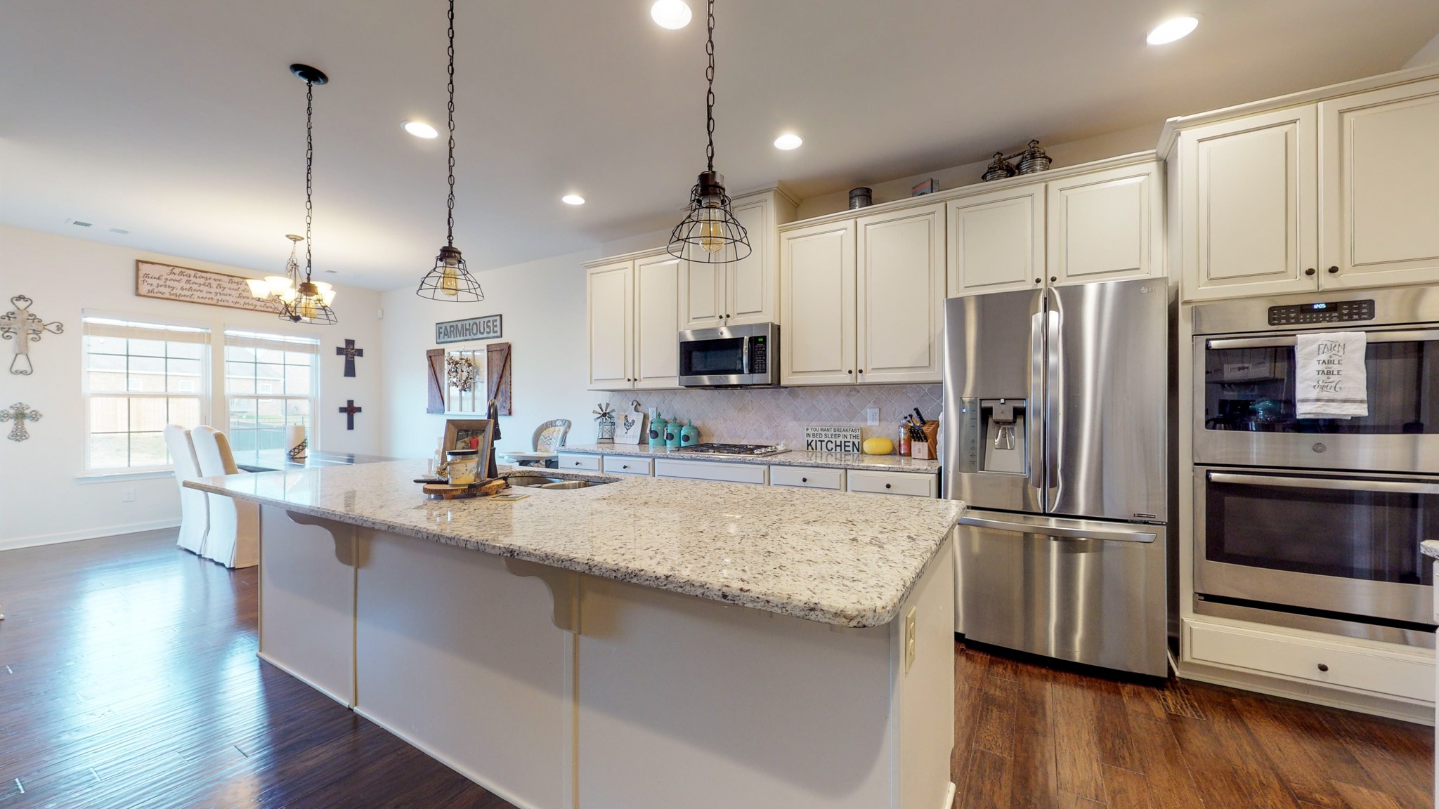 132 Hackney Lane Gallatin, TN 37066 - Photo 12 of 40 a kitchen with stainless steel appliances granite countertop a refrigerator a sink and a stove top oven