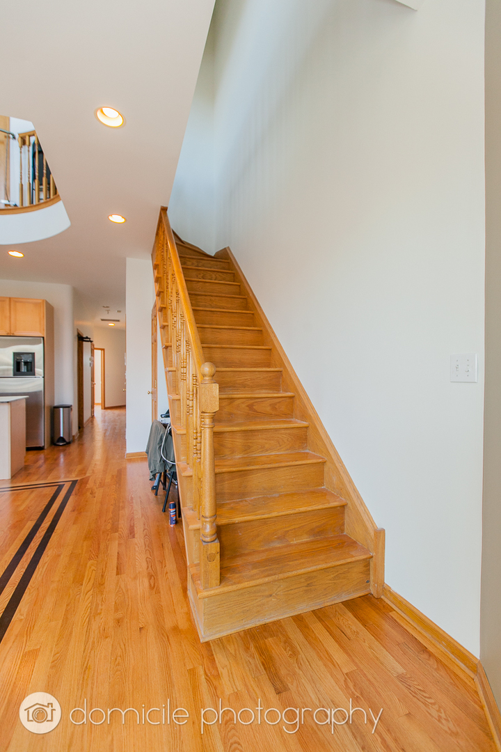 Undisclosed Address Chicago, IL 60618 - Photo 12 of 20 a view of an empty room with wooden floor