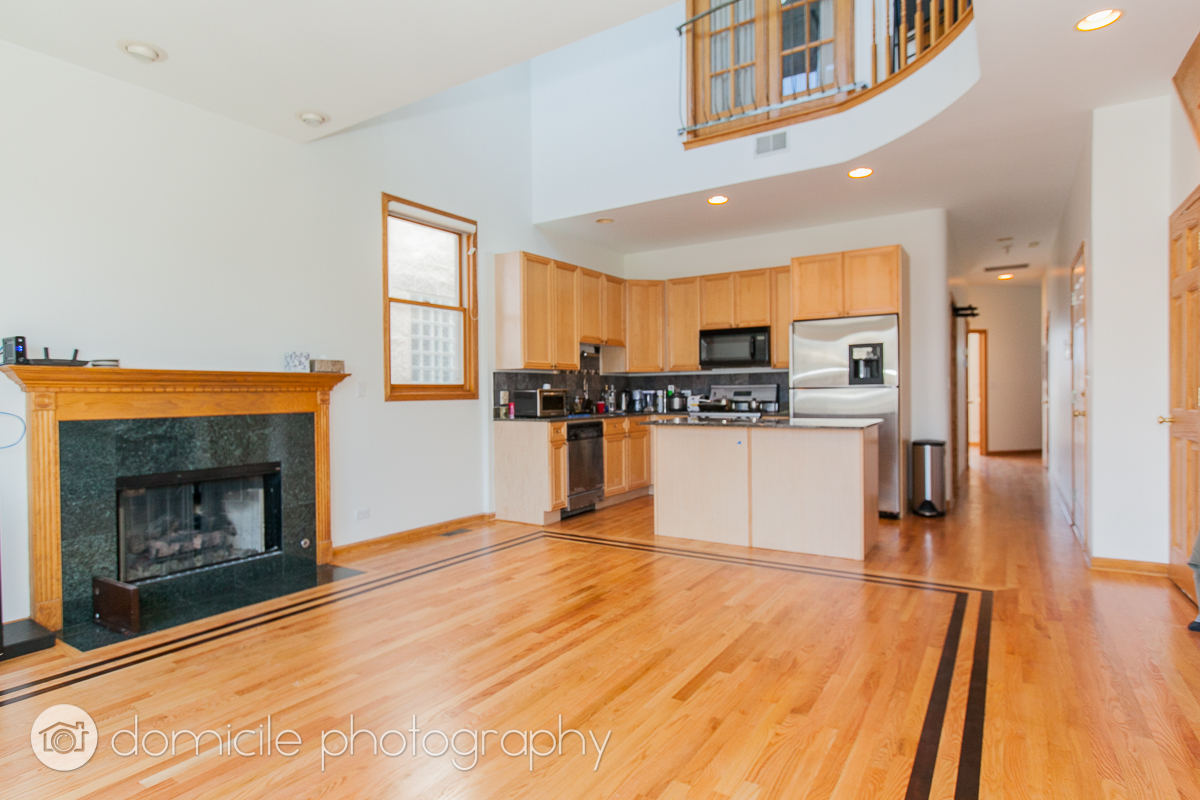 Undisclosed Address Chicago, IL 60618 - Photo 6 of 20 a kitchen with stainless steel appliances granite countertop a stove top oven and a refrigerator