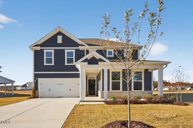 front view of a house with a yard