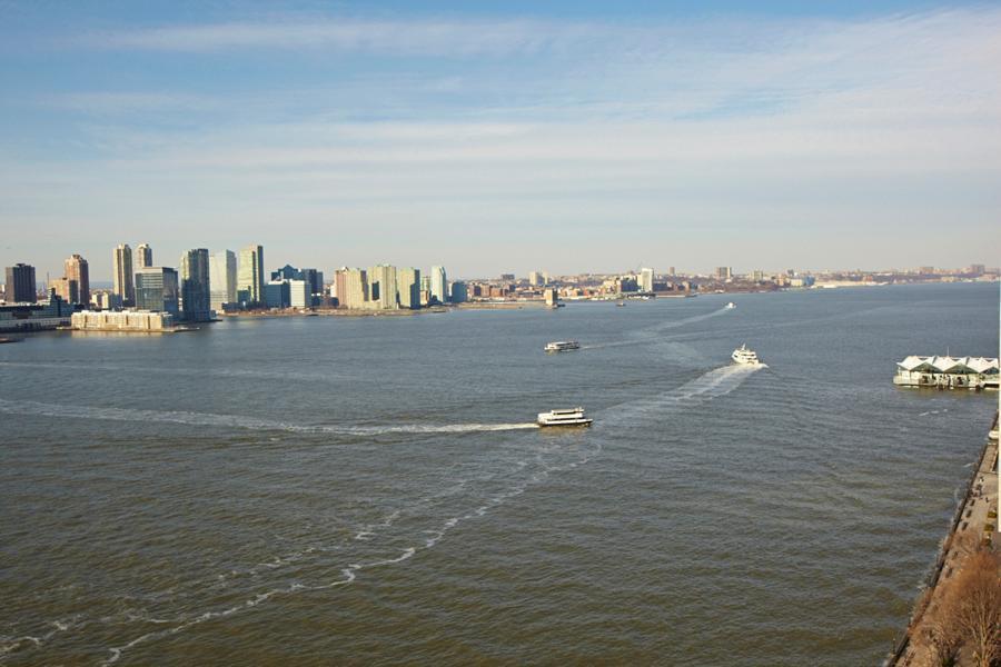 380 Rector Place, Unit 9J Manhattan, NY 10280 - Photo 4 of 7 a view of a lake and outdoor space