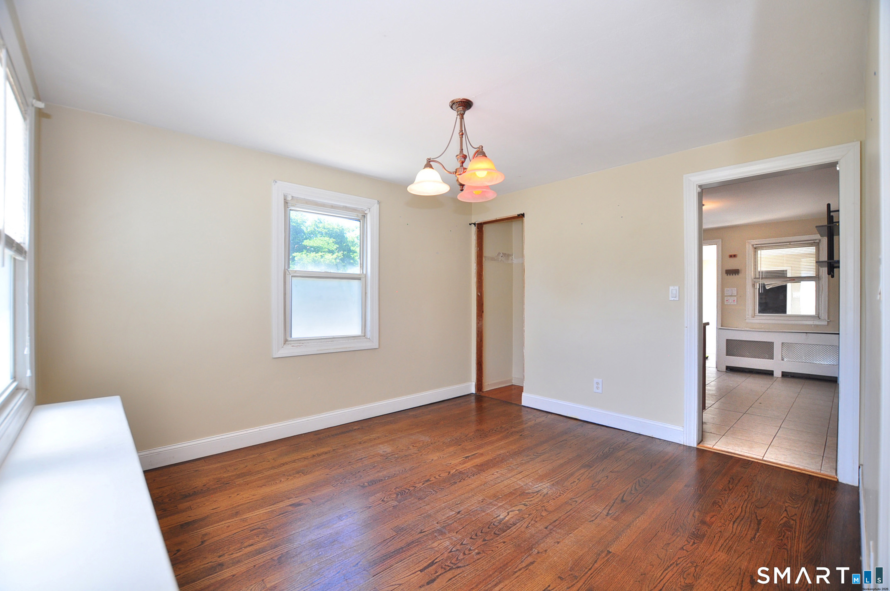 103 West Center Street Manchester, CT 06040 - Photo 11 of 29 wooden floor in an empty room with a window