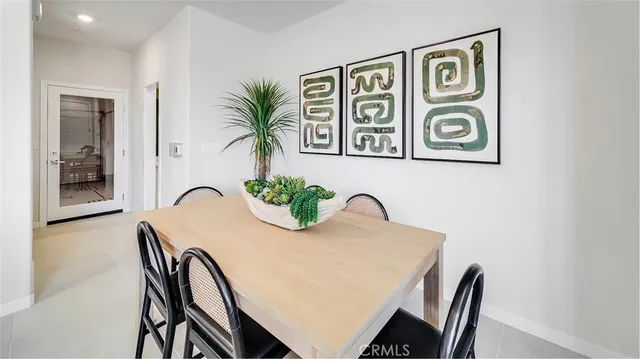 a view of a dining room with furniture and window