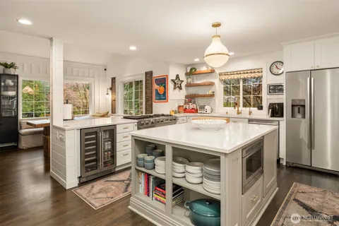 a kitchen with a stove and a refrigerator