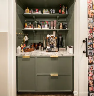 a room with water heater and shelf