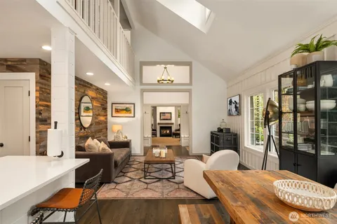 a bedroom with furniture and wooden floor