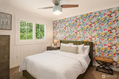 a bedroom with a bed and a window