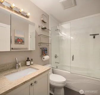 a bathroom with a sink a washer and dryer