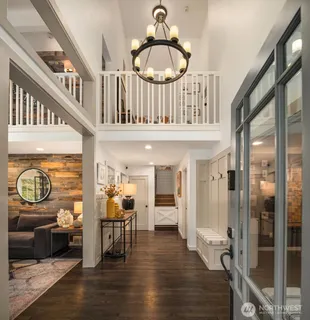 a view of a livingroom with furniture and hardwood floor