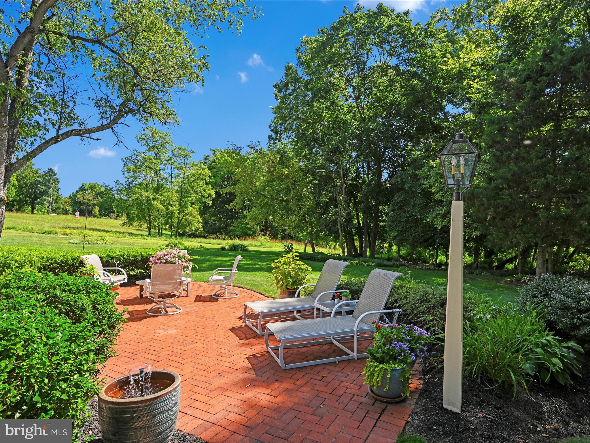 475 Sand Hill Road Pequea, PA 17565 - Photo 38 of 54 a view of a patio with couches chairs and a yard