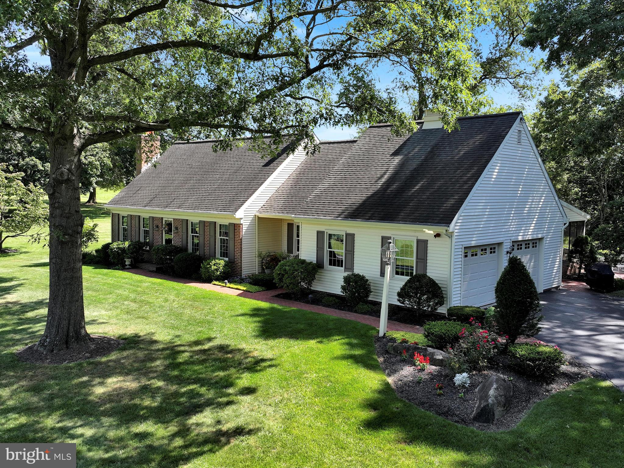 475 Sand Hill Road Pequea, PA 17565 - Photo 49 of 54 a view of a house with a yard potted plants and a patio