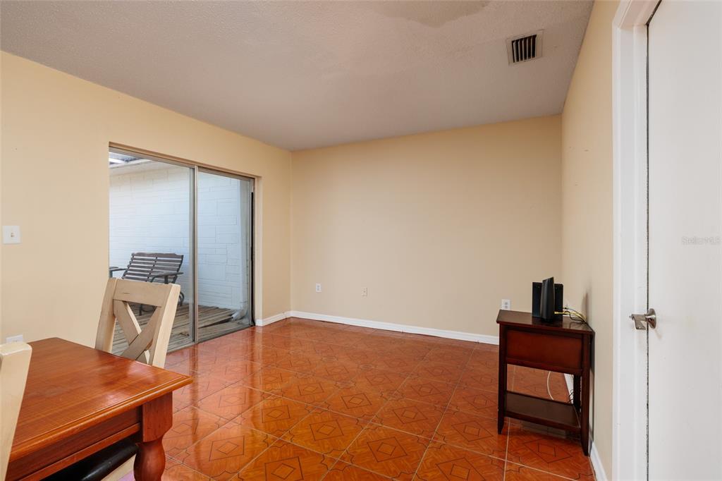 5409 Orange Blossom Road Pinellas Park, FL 33782 - Photo 11 of 30 a room with a table and a chair