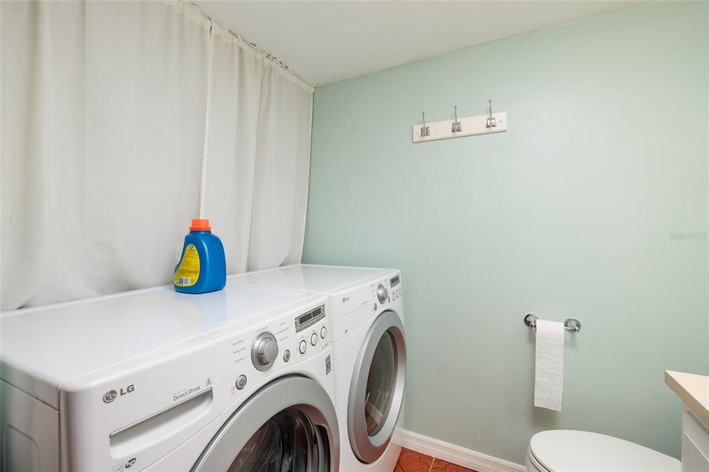 5409 Orange Blossom Road Pinellas Park, FL 33782 - Photo 14 of 30 a utility room with dryer and washer