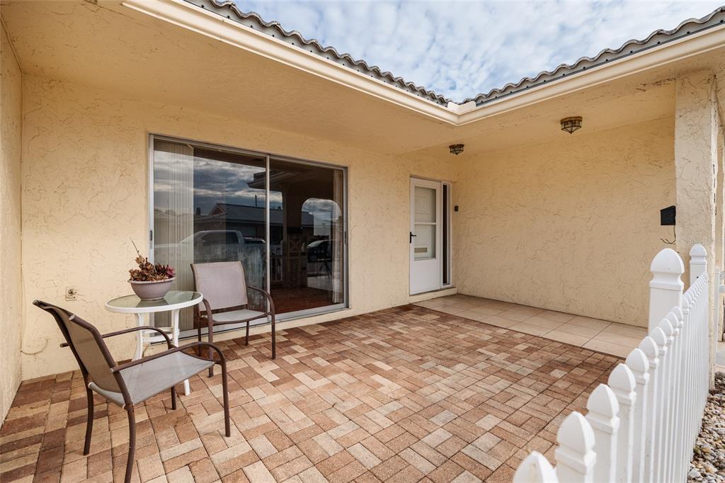 5409 Orange Blossom Road Pinellas Park, FL 33782 - Photo 22 of 30 a view of a hallway with wooden floor and a table